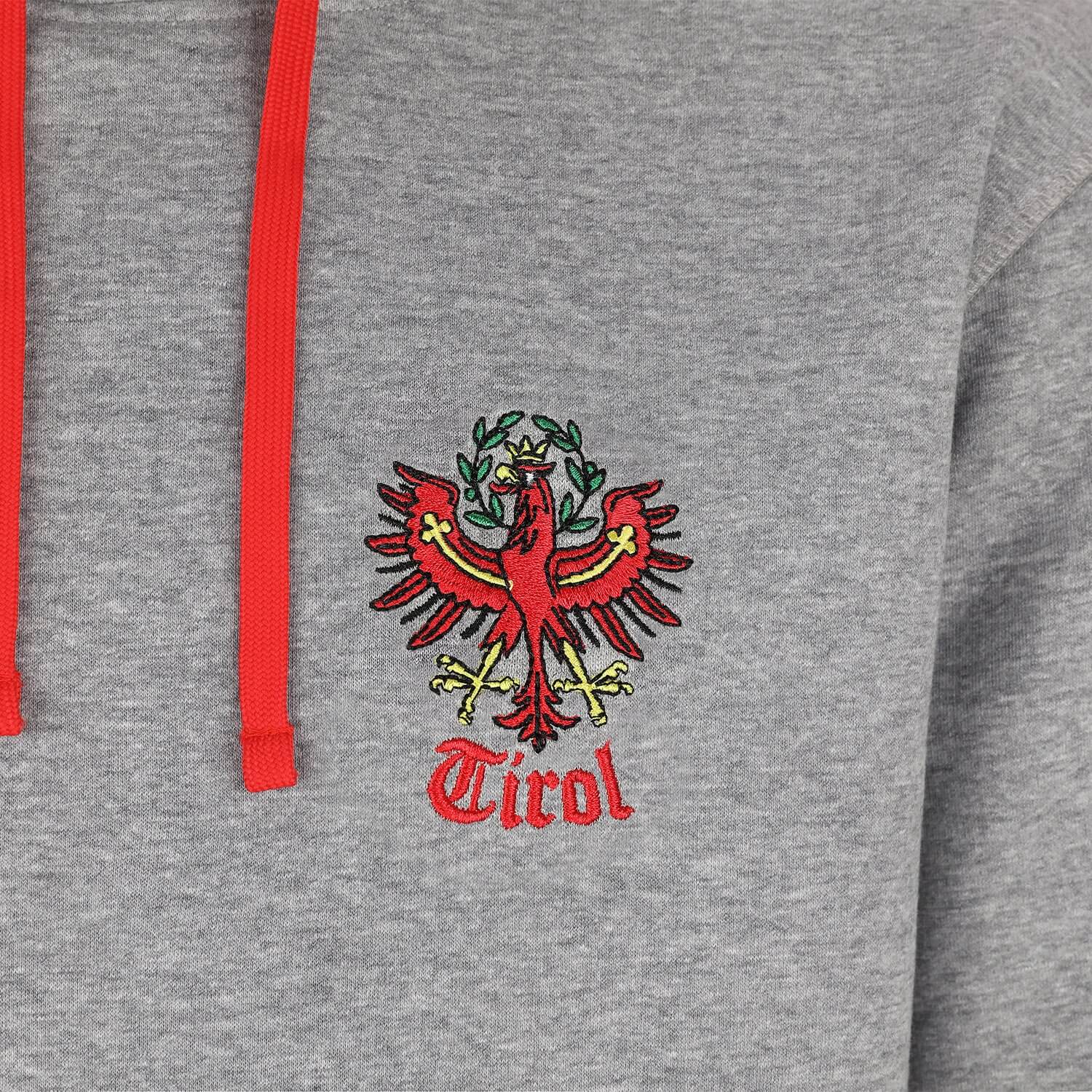 Vorderansicht des Herren Hoodies "Tirol", in der Farbe Grau, Detail Stickerei